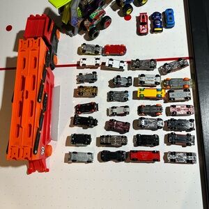 Hot wheels and matchbox cars with bonus carrier truck and monster trucks